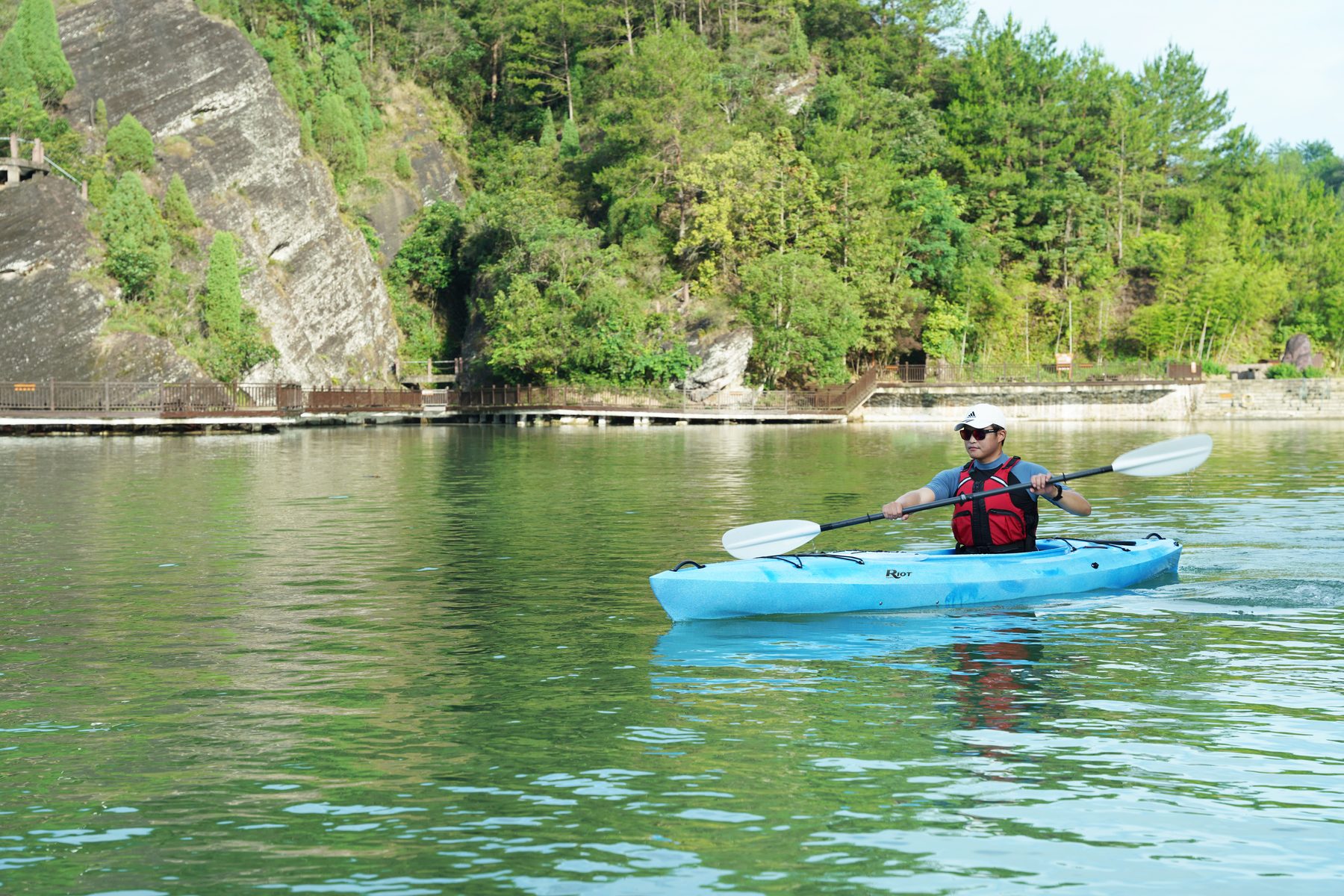 Paddler cruising the Bayside 12 LV on a calm lake