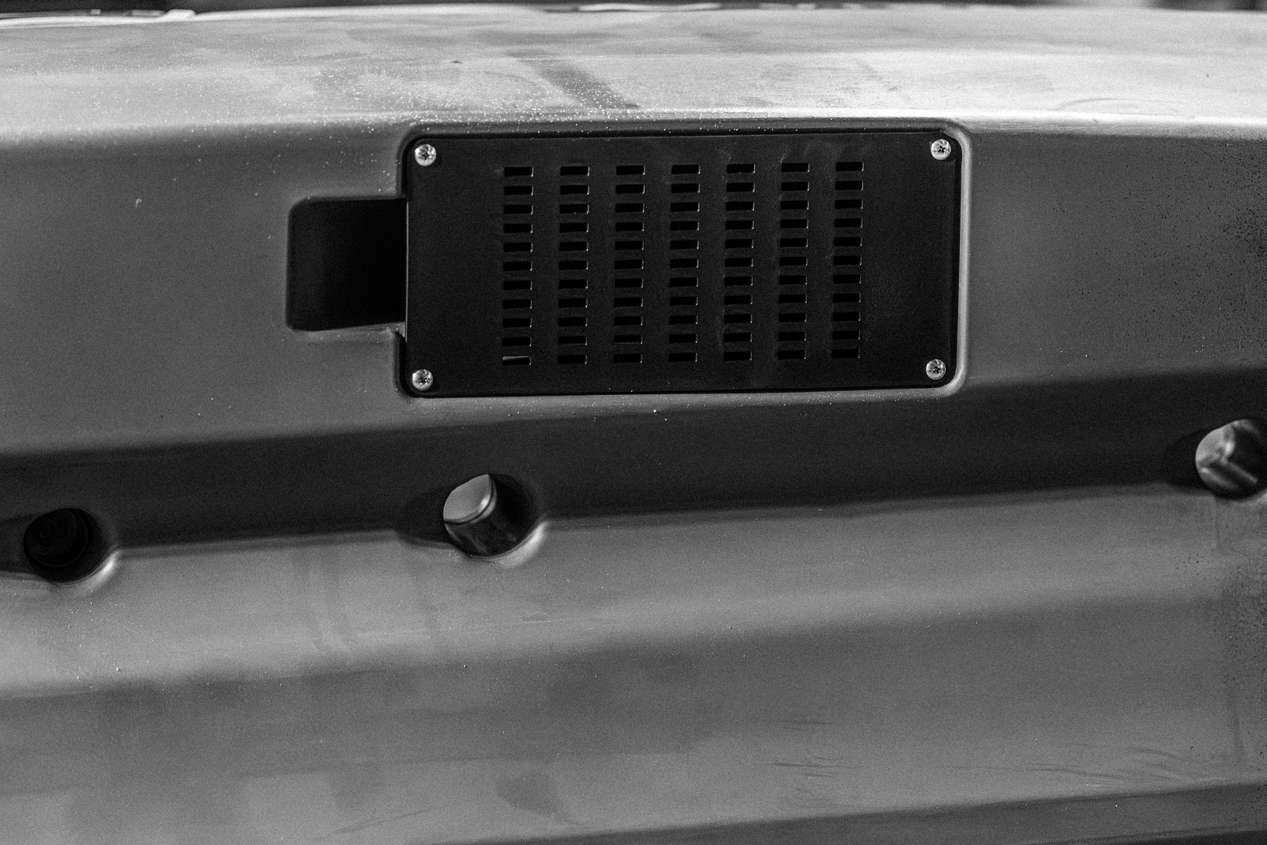 Integrated transducer pass-through scupper on the Sea Ghost 105