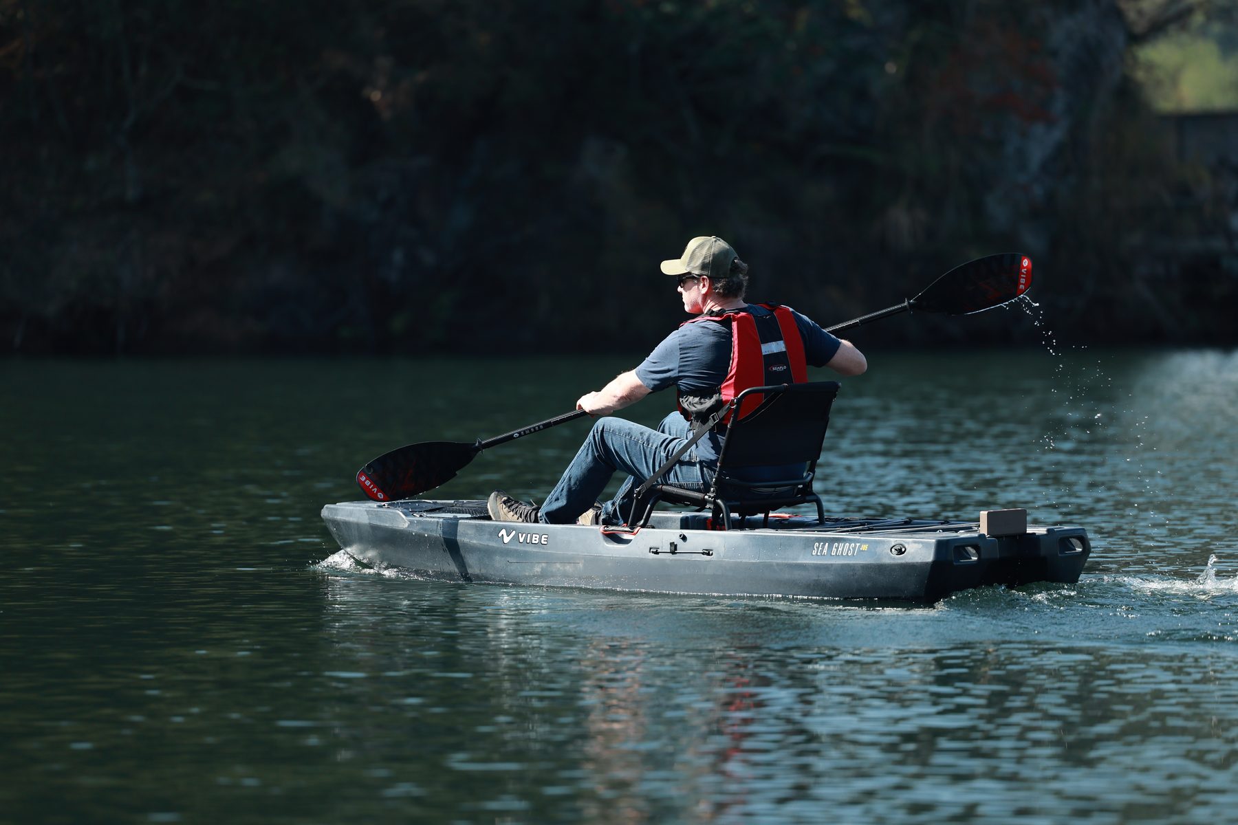 Angler paddling the Sea Ghost 105 on a calm river