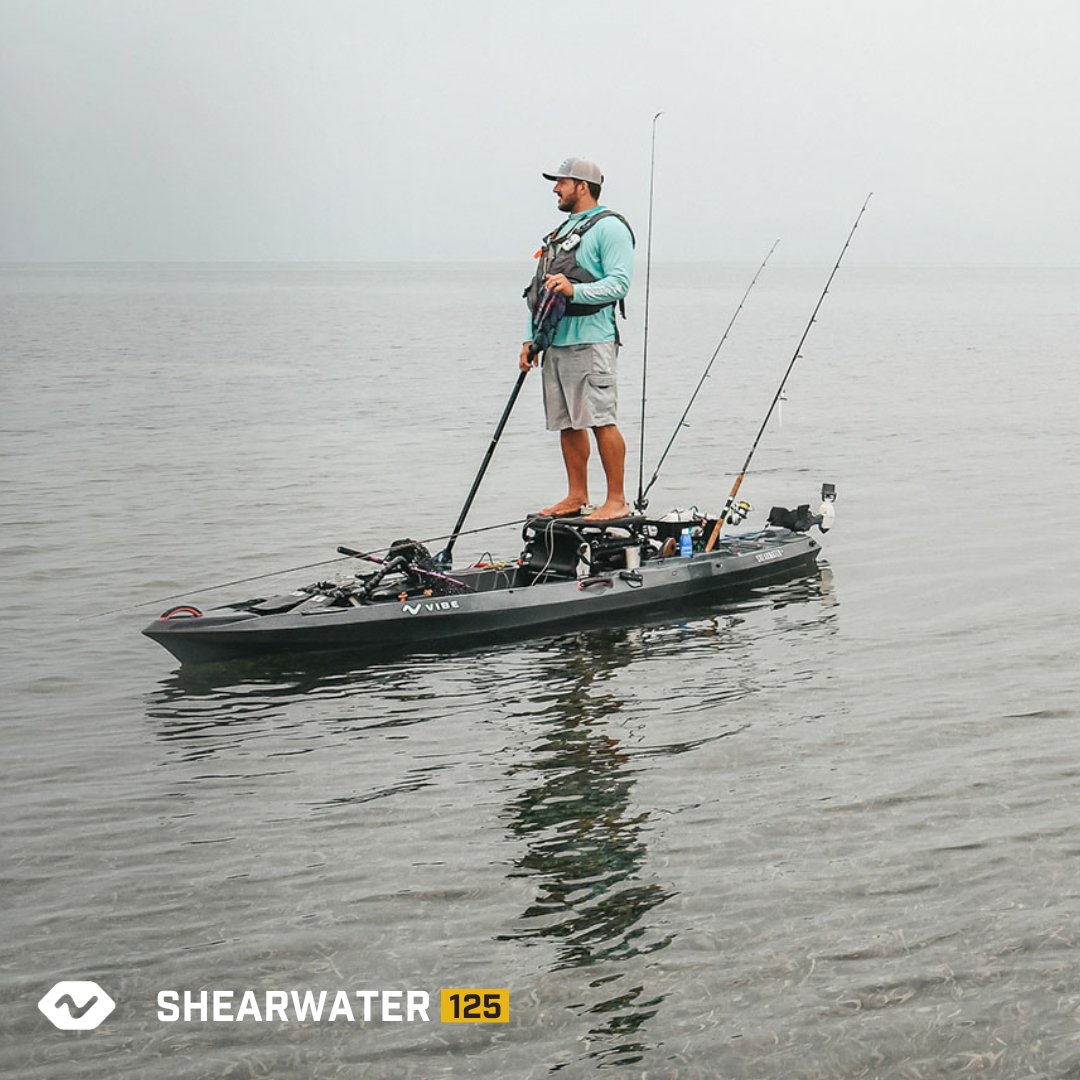 Angler standing on the Shearwater 125 in foggy bay water