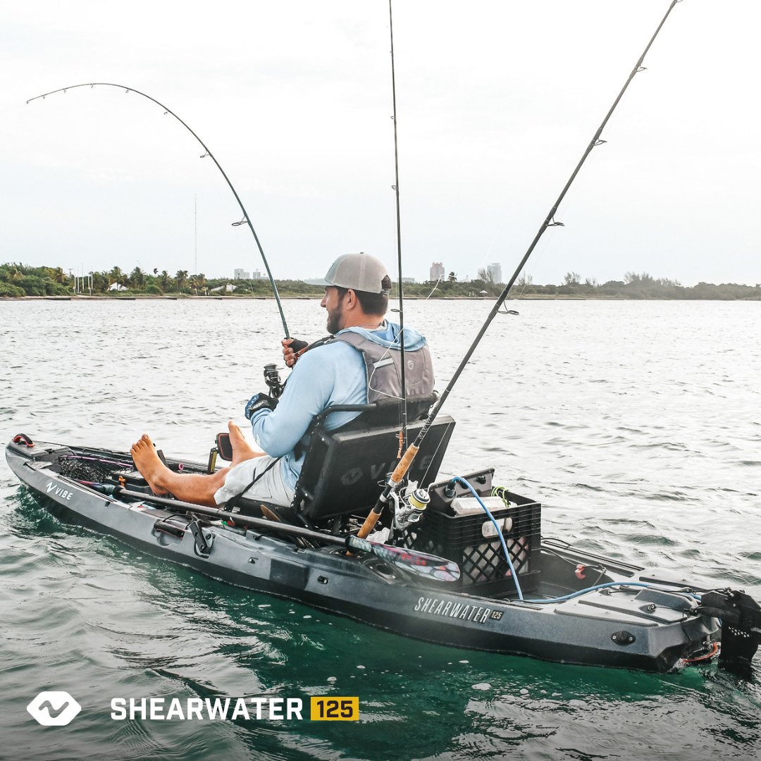 Angler reclined fishing two rods, Slate Blue Shearwater 125